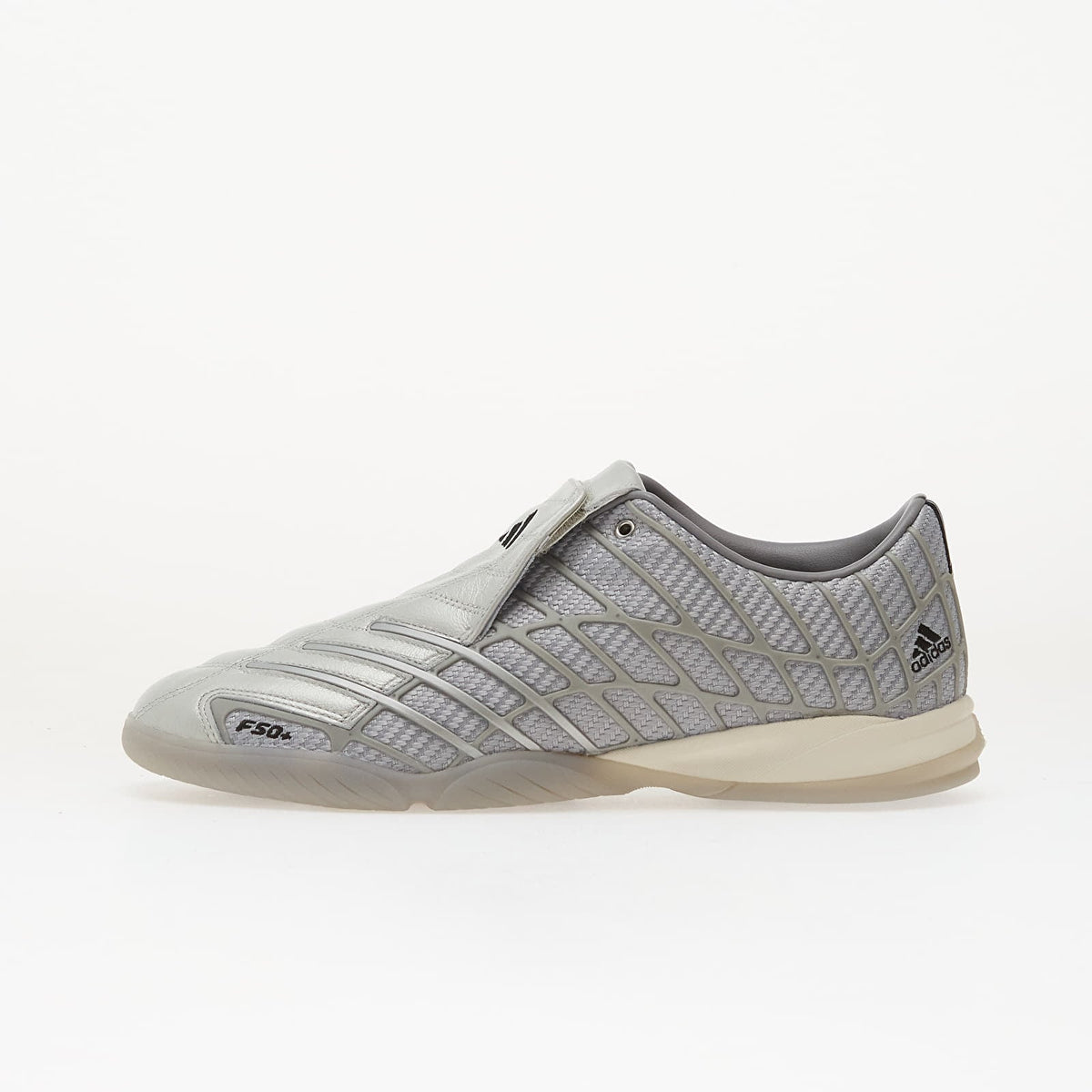 Silver adidas F50 Sala low-profile sneaker on a clean light editorial background