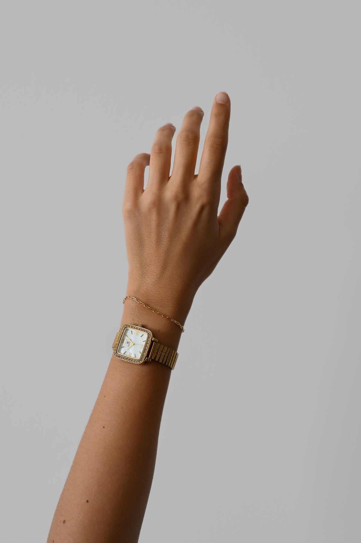 Minimal women’s wristwatch and bracelet stack for an elegant styling guide
