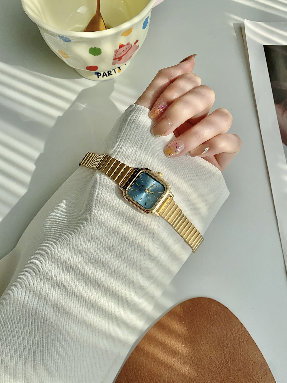 Annie Time square expansion bracelet watch in gold tone with blue dial