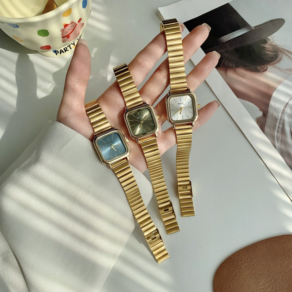 Annie Time square expansion bracelet watches in gold tone with blue green and white dials