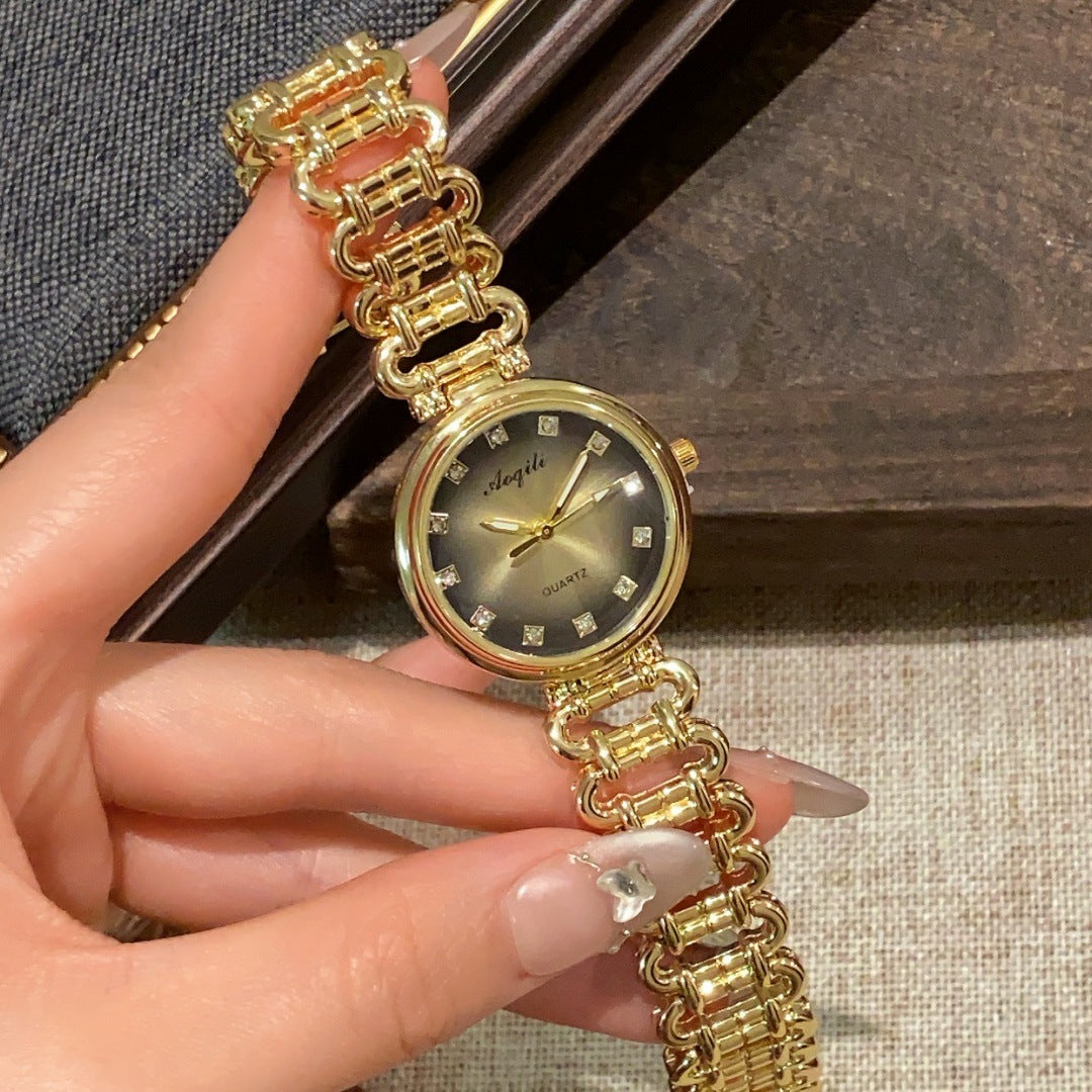Aoqili round link bracelet watch in gold tone with champagne dial