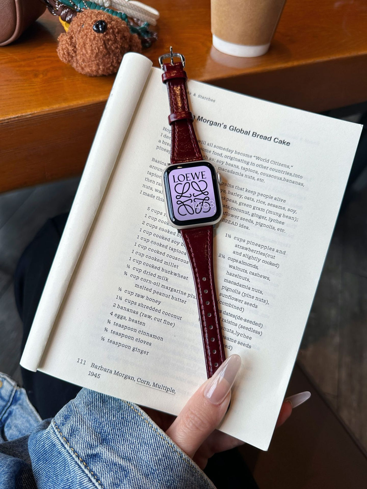 Burgundy leather Apple Watch band with silver-tone buckle