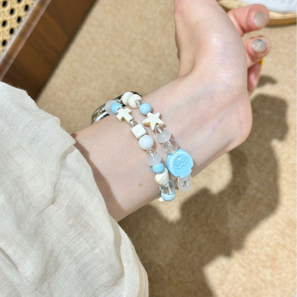 Blue white double-strand smartwatch bracelet band side wrist view