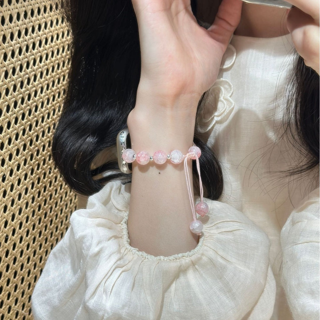 Pink beaded butterfly charm Apple Watch bracelet band lifestyle wrist view