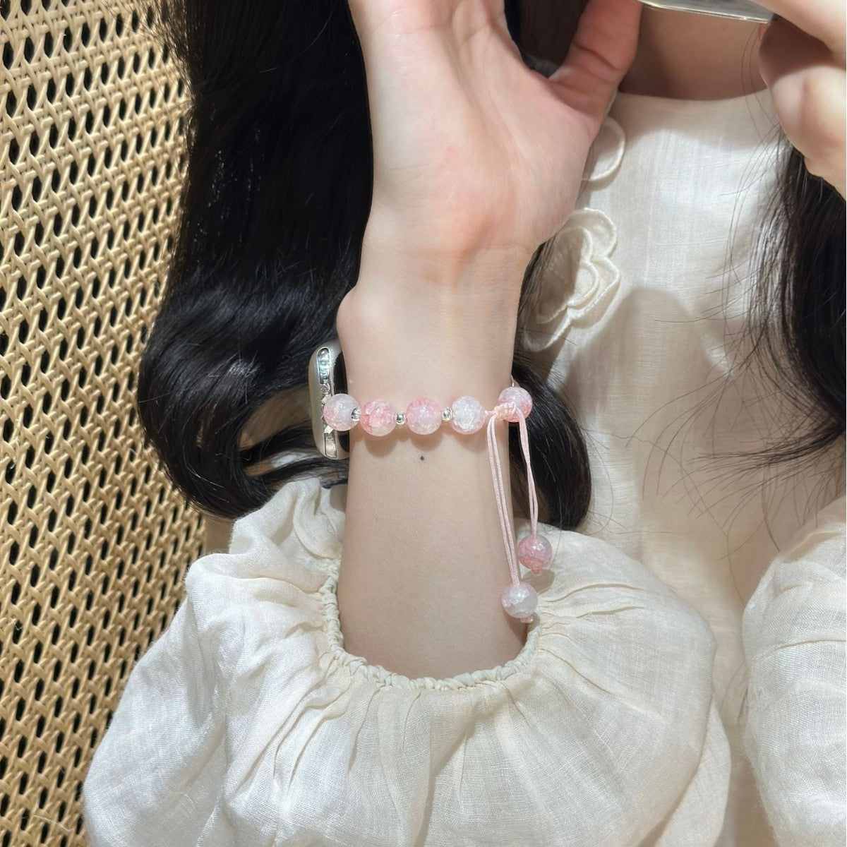 Pink beaded butterfly charm Apple Watch bracelet band lifestyle wrist view
