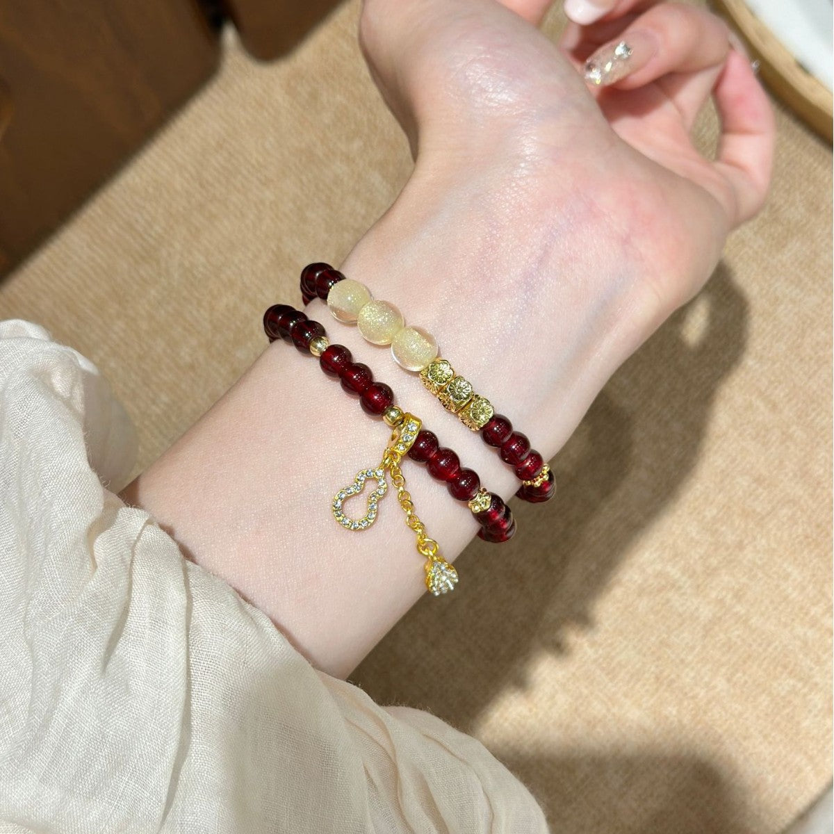 Burgundy ivory Apple Watch bracelet band with gold-tone pendant