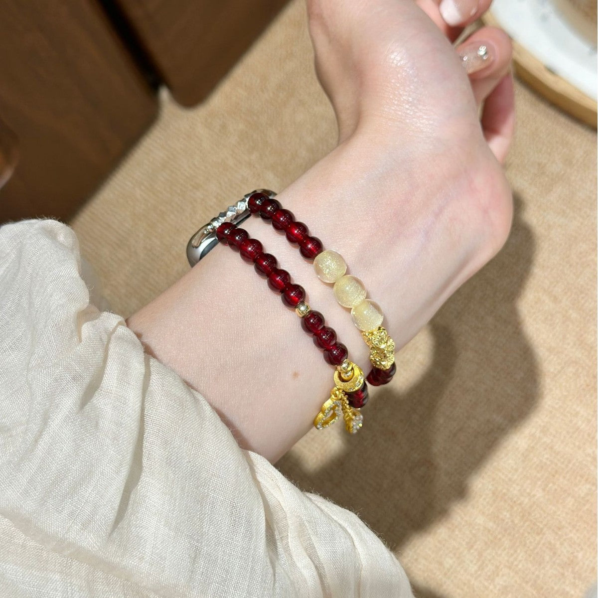 Burgundy and ivory Apple Watch bracelet band side view