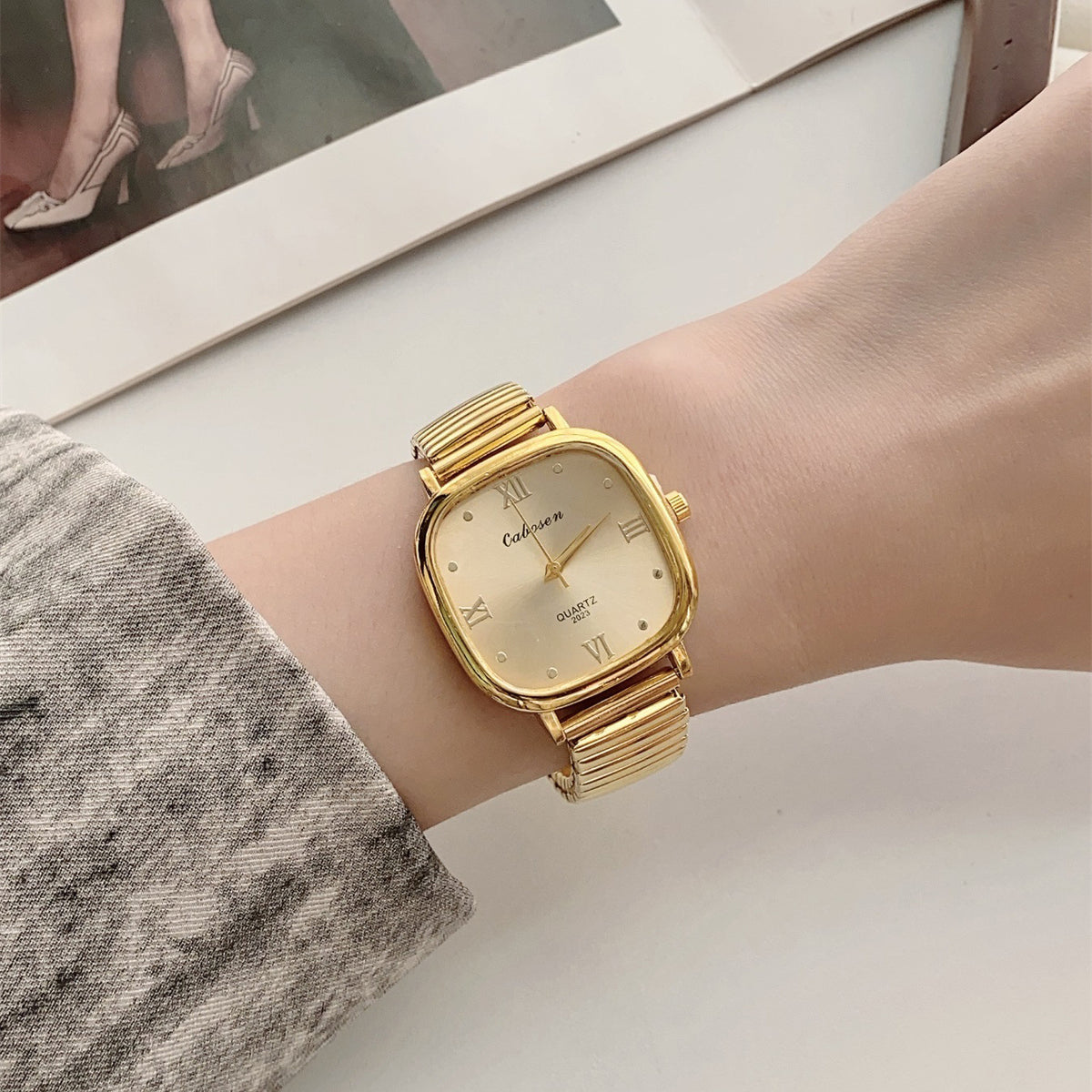 CABOSEN vintage gold-tone cushion-shaped Roman numeral quartz watch with stretch bracelet