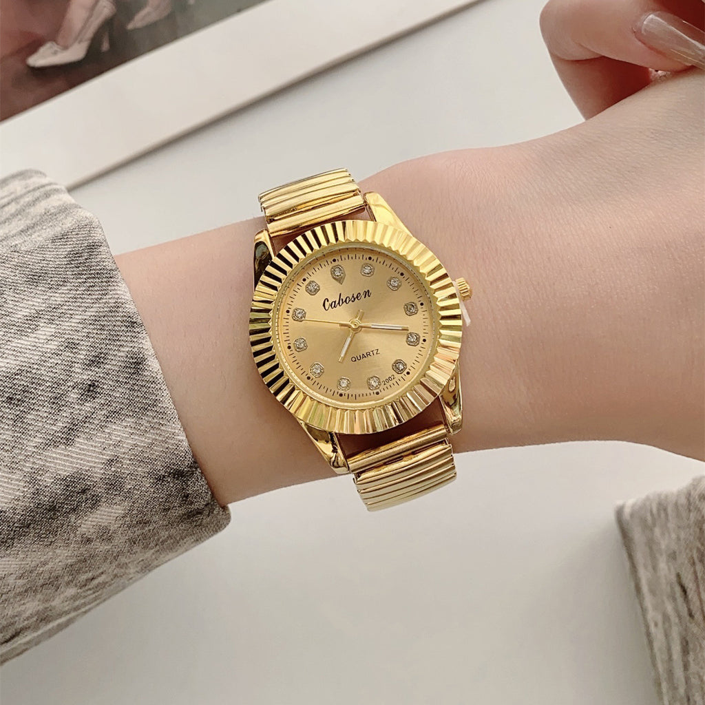 CABOSEN vintage gold-tone quartz watch with stretch bracelet and crystal-style hour markers on wrist