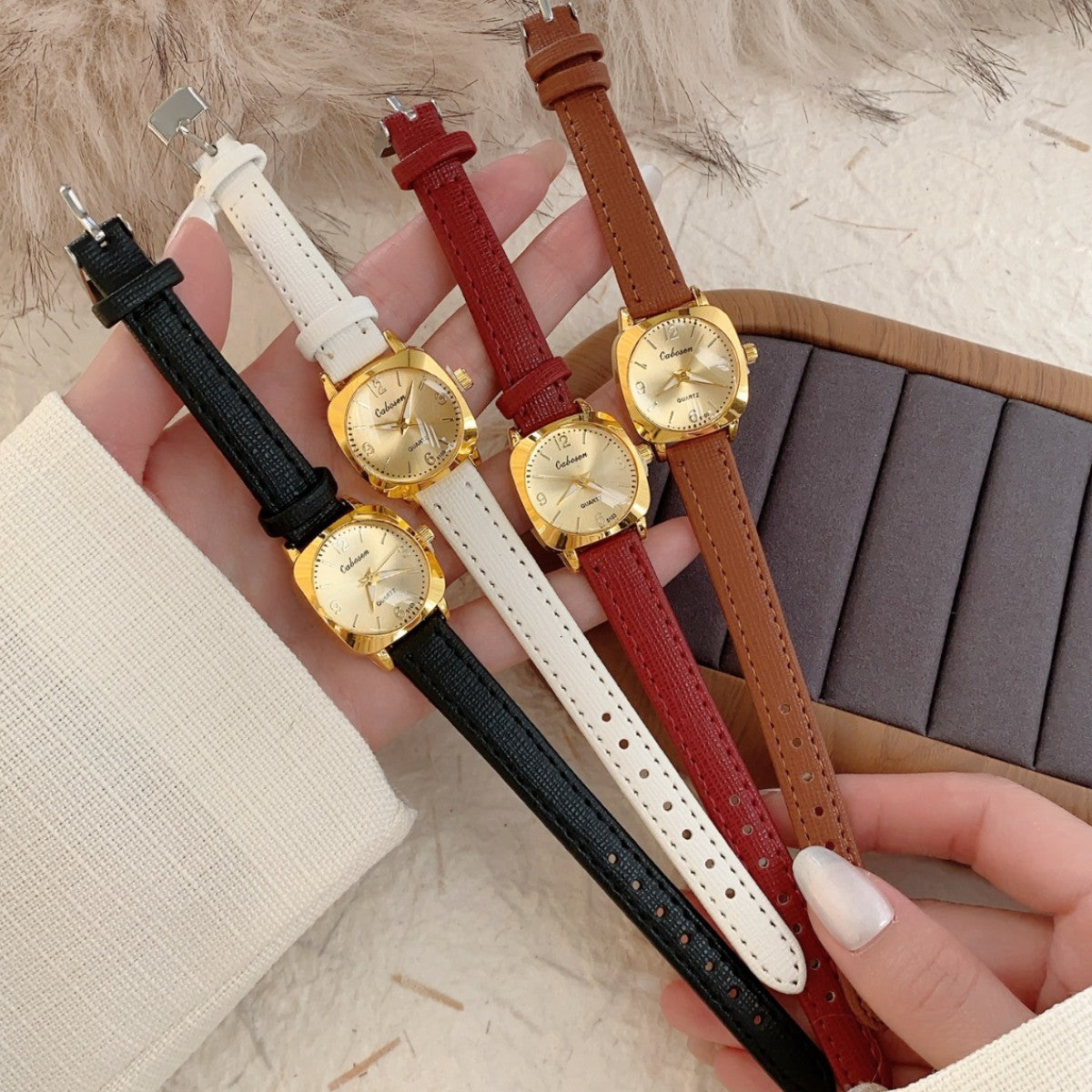 CABOSEN vintage small women's watch shown with black, white, burgundy and brown leather-style straps