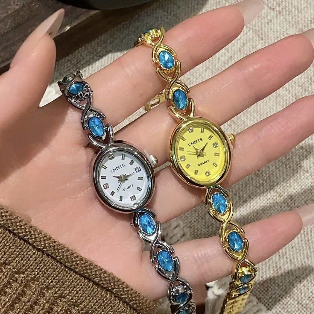 CHISTE blue cabochon-style bracelet watches in gold and silver tones