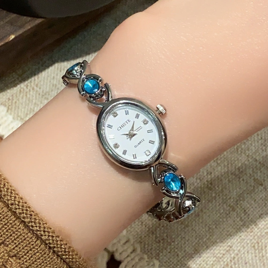 CHISTE blue cabochon-style bracelet watch in silver tone with white dial