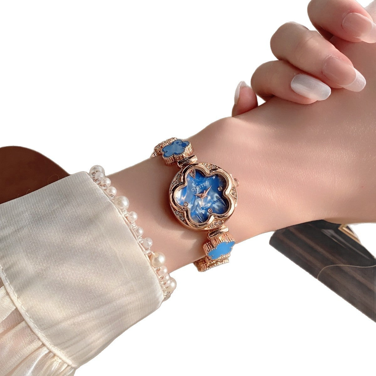 CHISTE flower bracelet watch with blue floral dial and accents