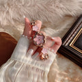 CHISTE flower bracelet watch with pink floral dial and accents