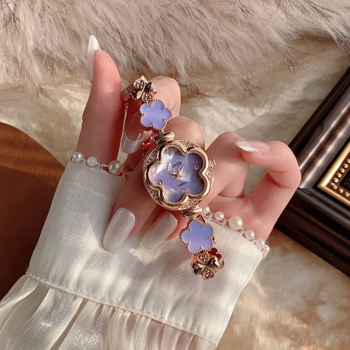 CHISTE flower bracelet watch with purple floral dial and accents