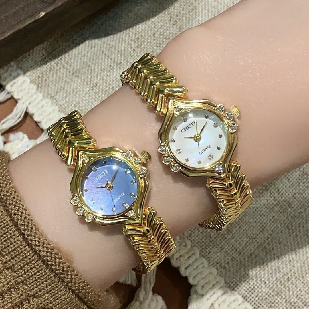 CHISTE vintage bracelet watches in gold tone with white and blue dials