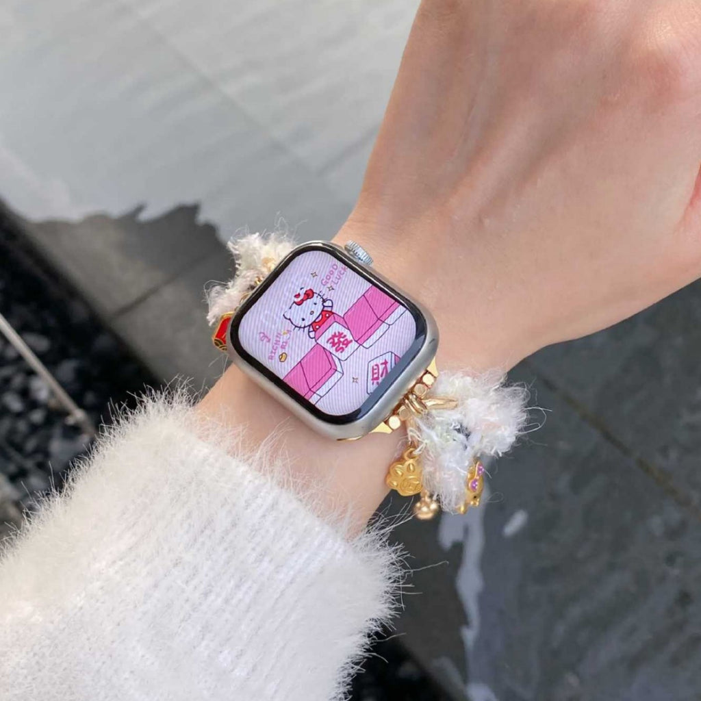 White fuzzy charm Apple Watch band close-up
