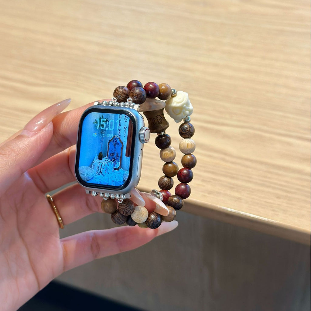 Brown rose double-strand Apple Watch bracelet band held in hand