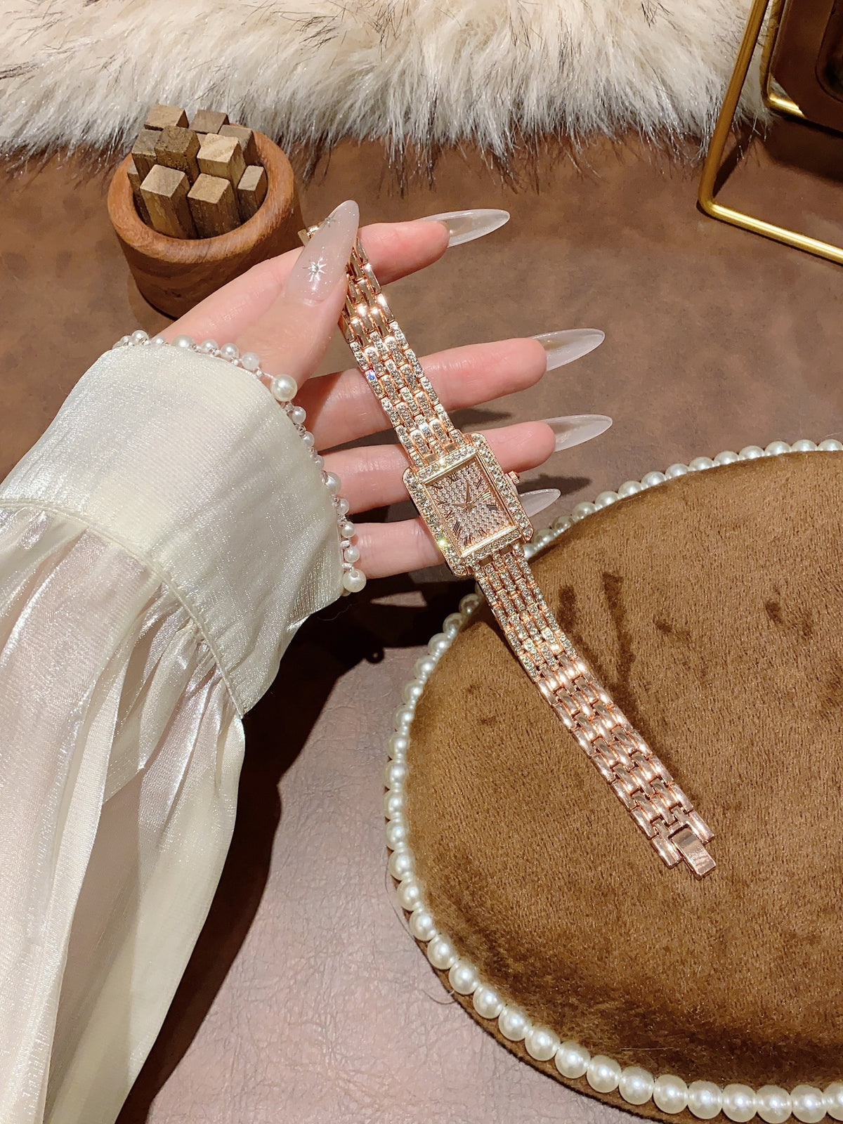 Crystal-style rectangular jewelry watch in rose-gold tone