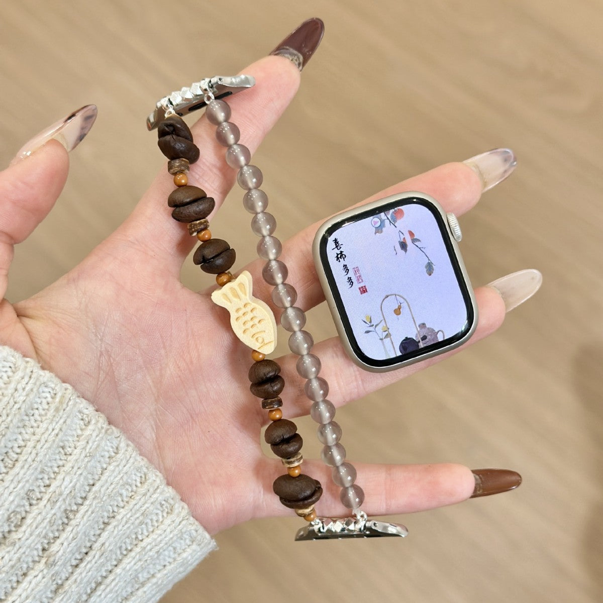 Brown wood and smoky bead fish charm Apple Watch bracelet band open view