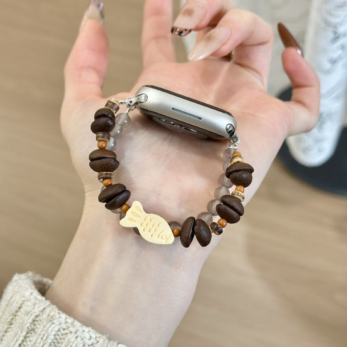 Brown wood and smoky bead fish charm Apple Watch bracelet band side view
