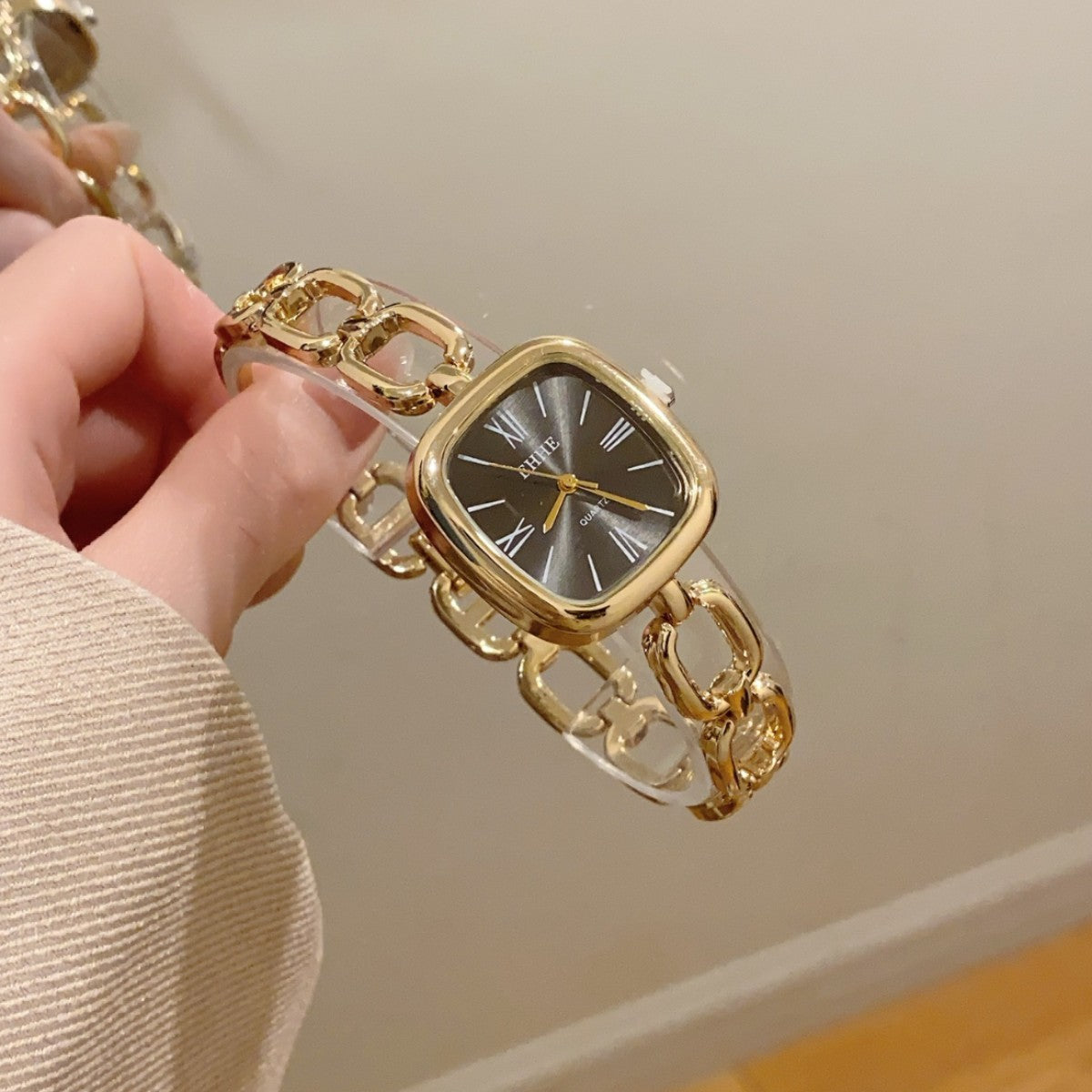 EHHE open-link square bracelet quartz watch in gold tone with black dial