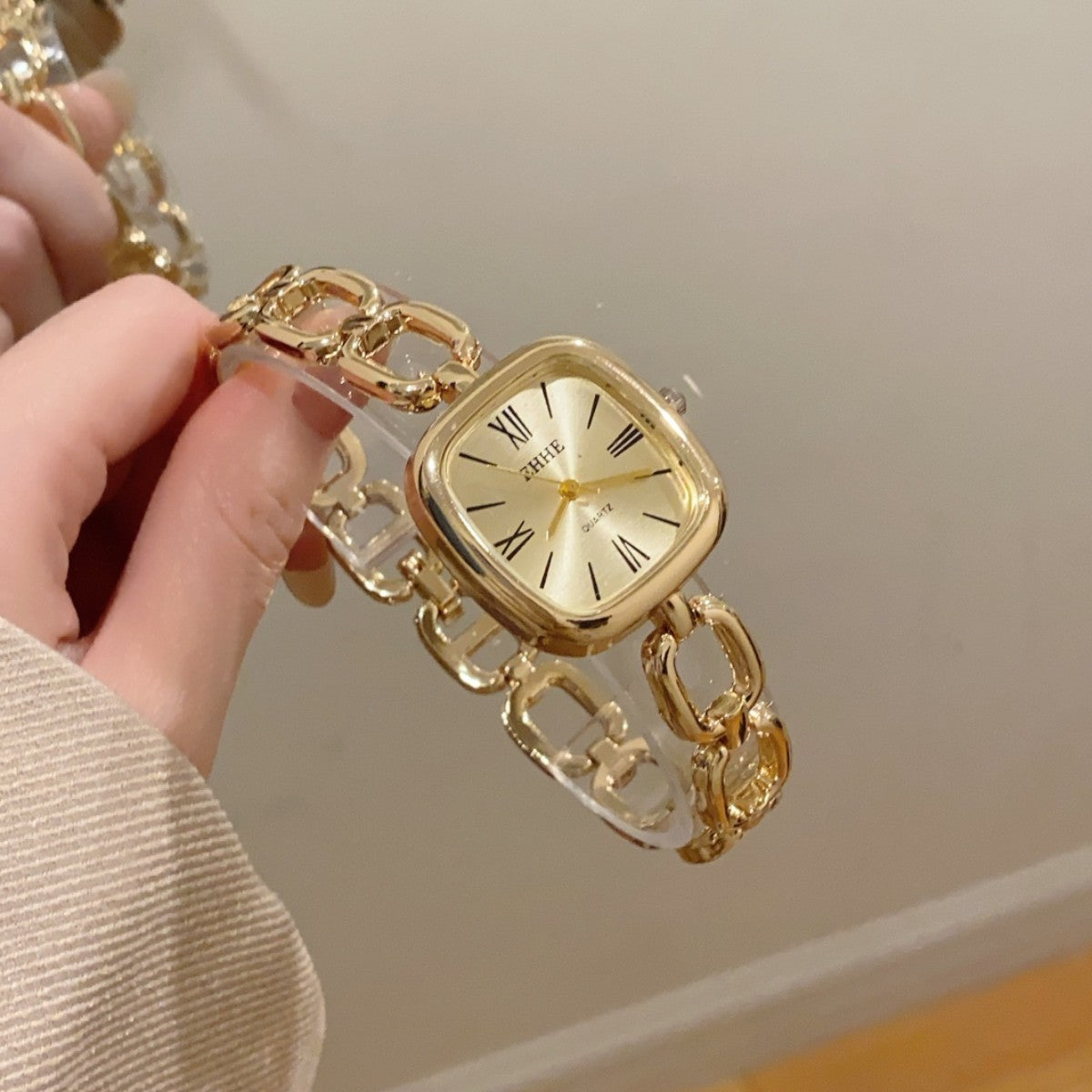 EHHE open-link square bracelet quartz watch in gold tone with champagne dial