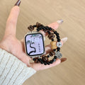 Black and brown double-strand jewellery Apple Watch band with coffee-bean style beads and silver-tone charms