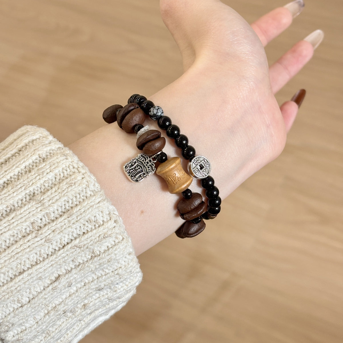 Black and brown beaded Apple Watch bracelet band worn on wrist
