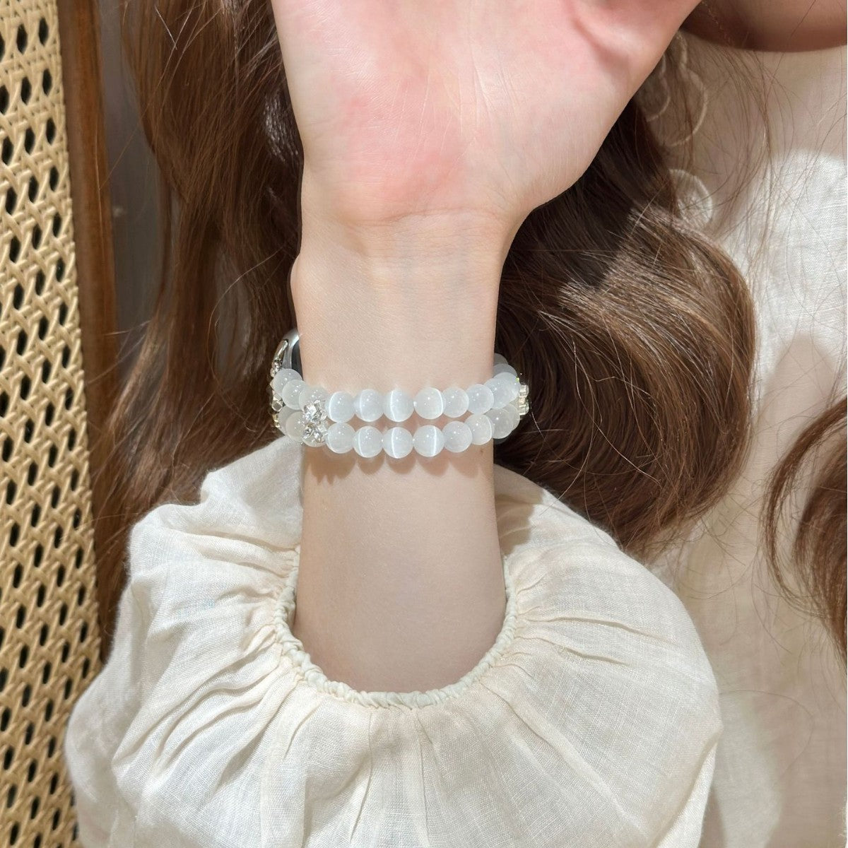 Frosted white double-strand Apple Watch bracelet band lifestyle view