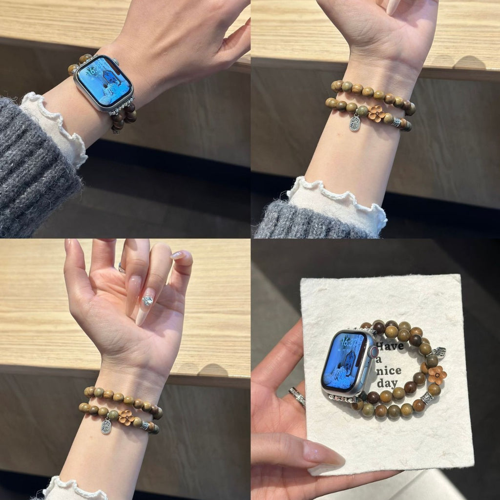 Green sandalwood-style double-strand beaded Apple Watch band worn on wrist