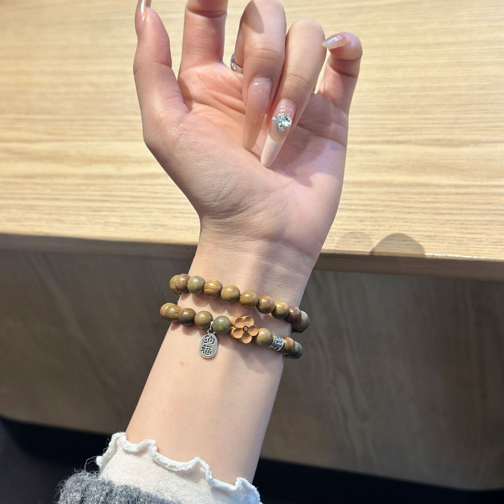 Green brown beaded Apple Watch bracelet band worn on wrist