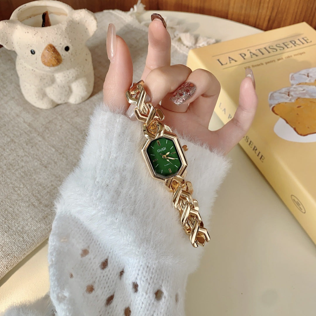 GUDI geometric bracelet watch in gold tone with green dial hand view