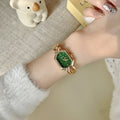 GUDI geometric bracelet watch in gold tone with green dial