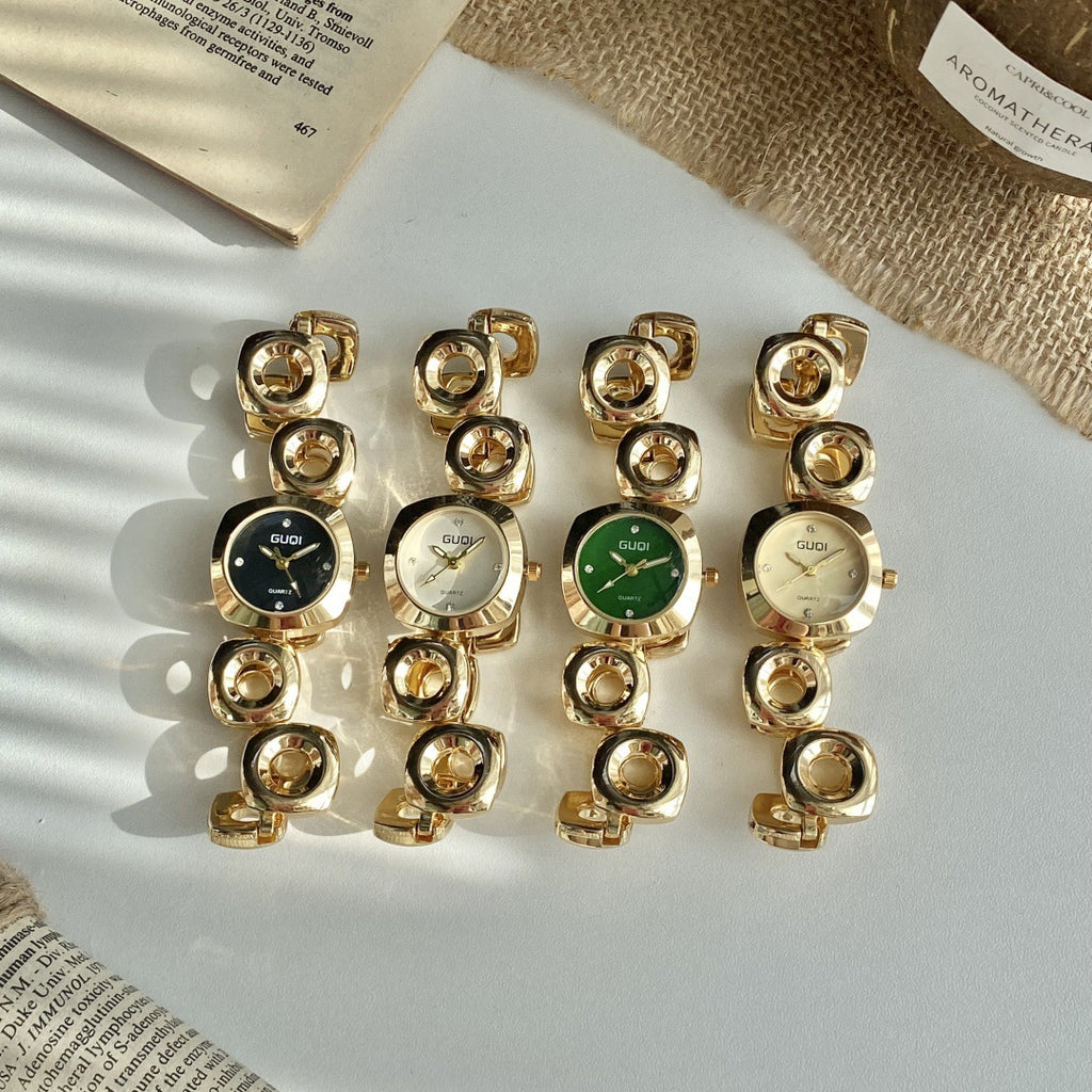 GUDI open-link round jewelry watch collection in gold tone