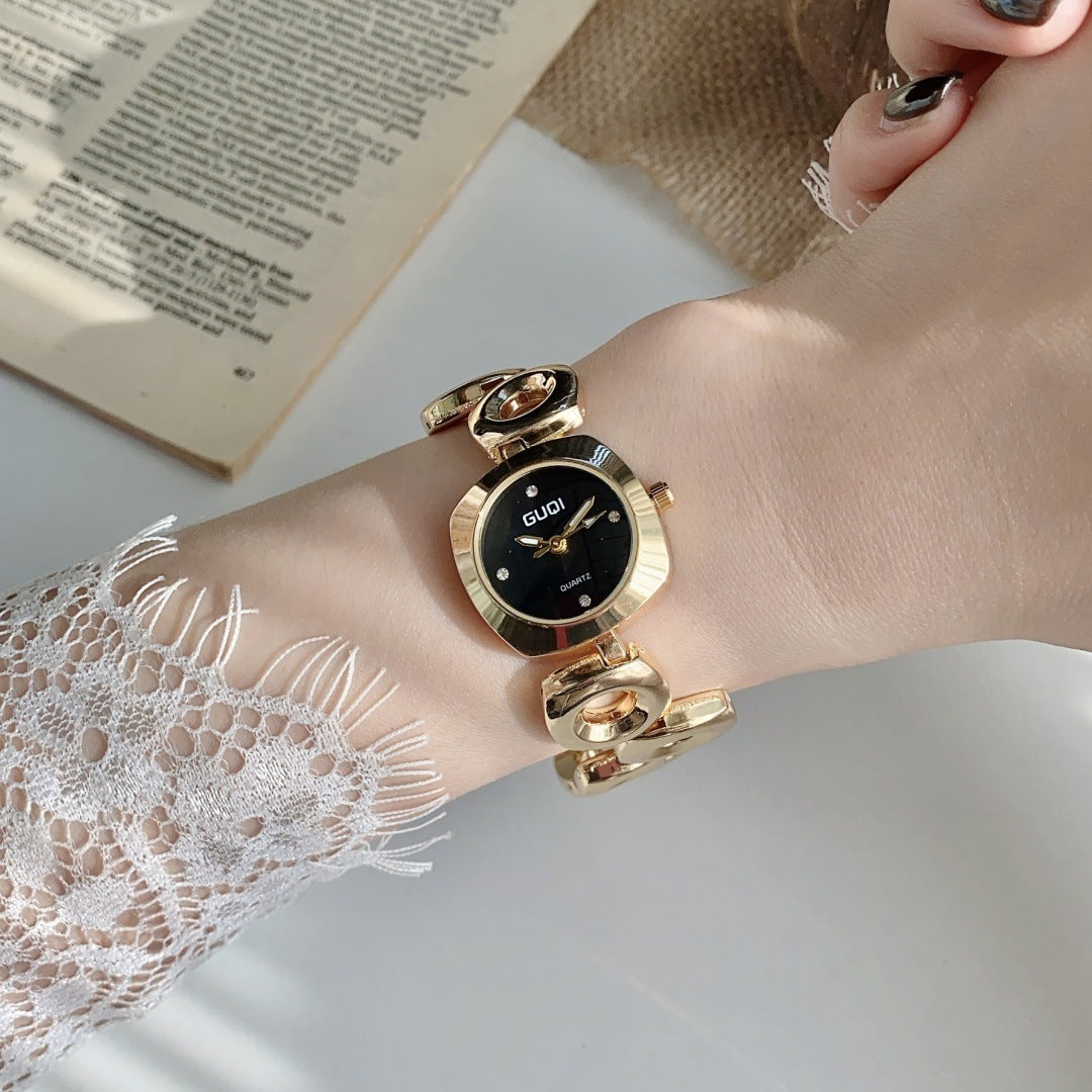 GUDI open-link round jewelry watch in gold tone with black dial