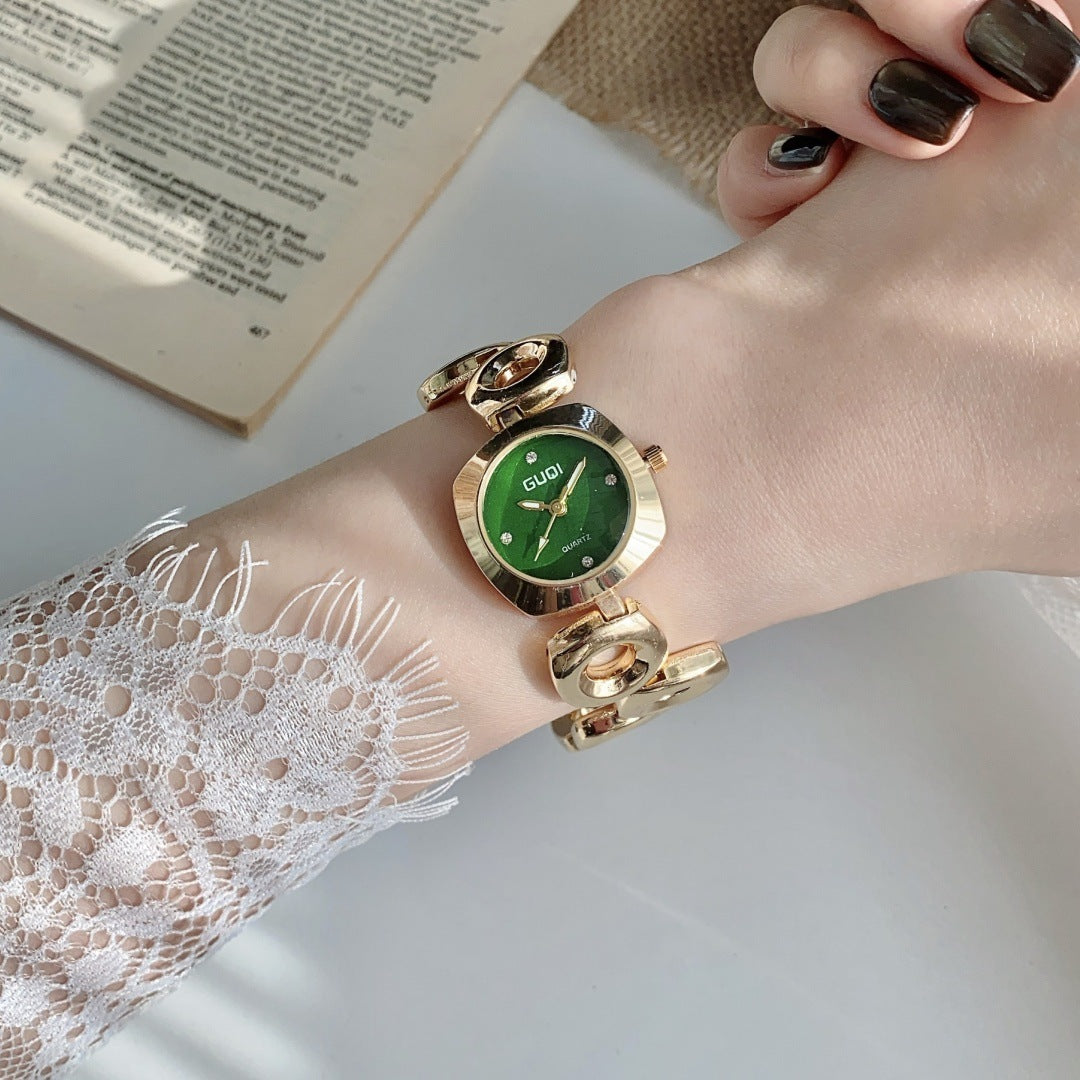 GUDI open-link round jewelry watch in gold tone with green dial