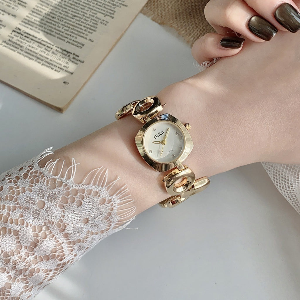 GUDI open-link round jewelry watch in gold tone with white dial