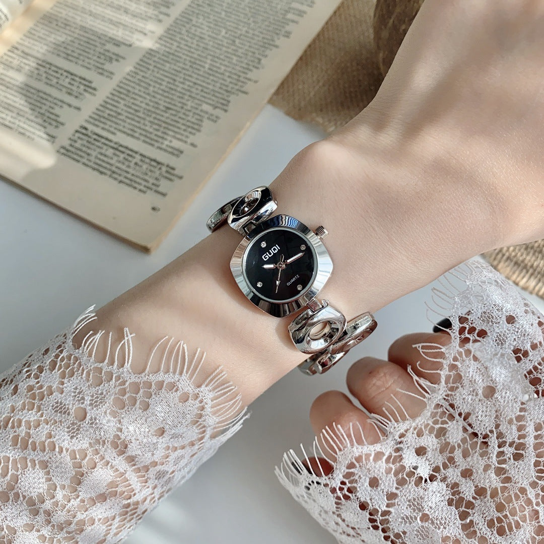 GUDI open-link round jewelry watch in silver tone with black dial