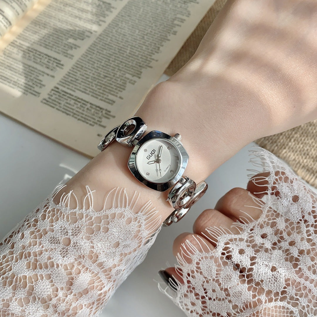 GUDI open-link round jewelry watch in silver tone with white dial