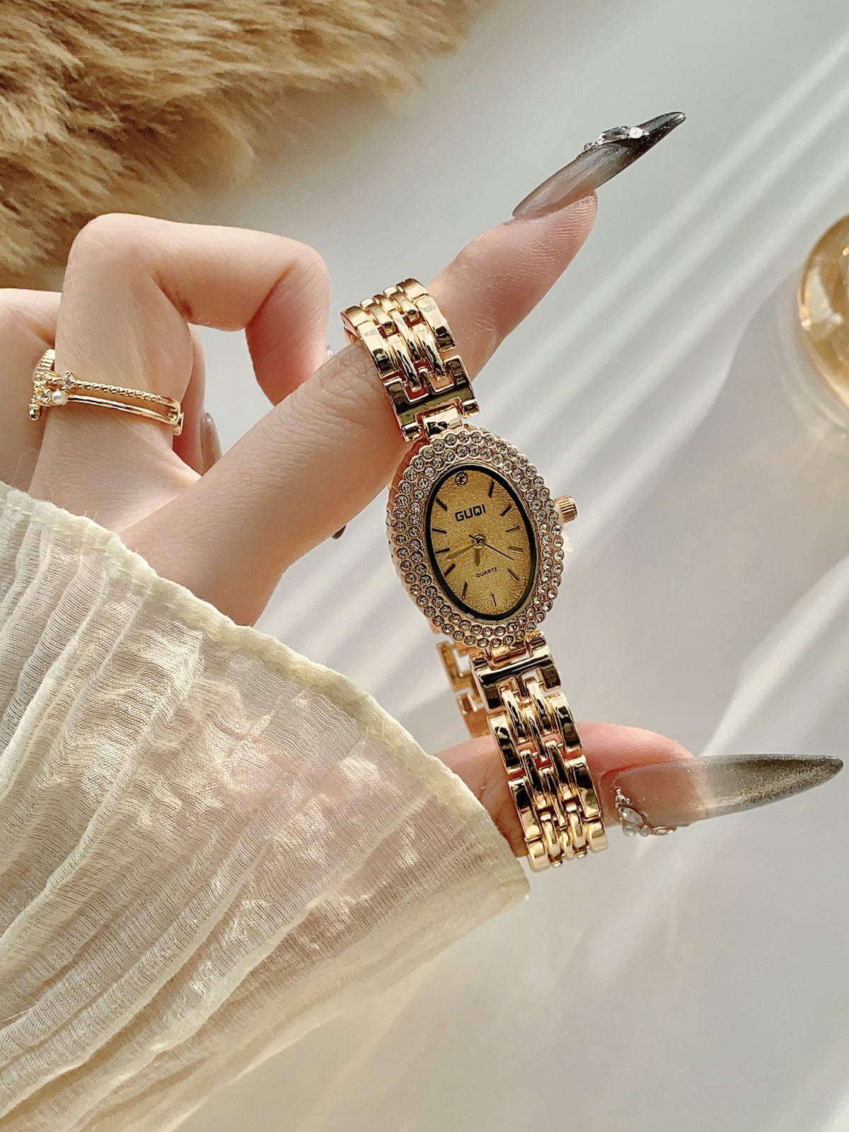 GUDI oval crystal-style jewelry watch with classic link bracelet and champagne dial