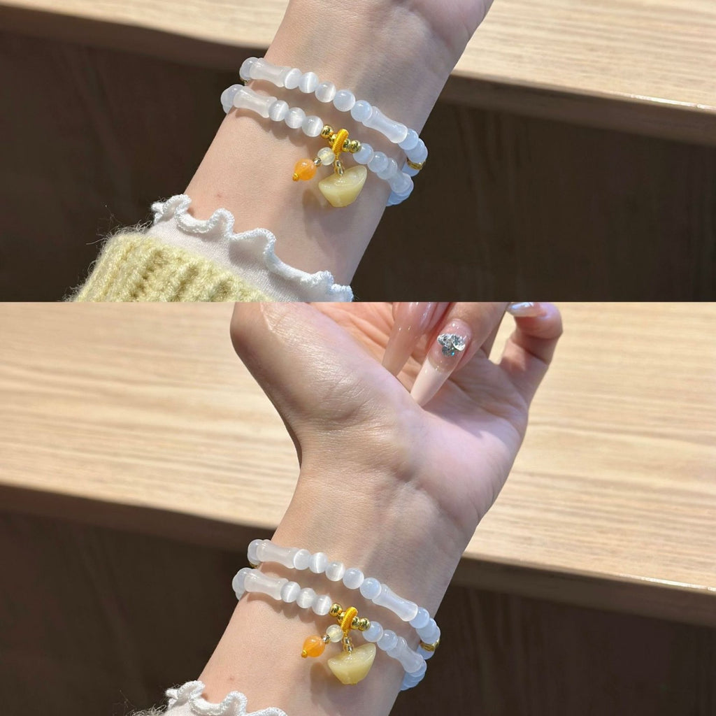 Frosted white double-strand beaded Apple Watch band with warm honey heart charm