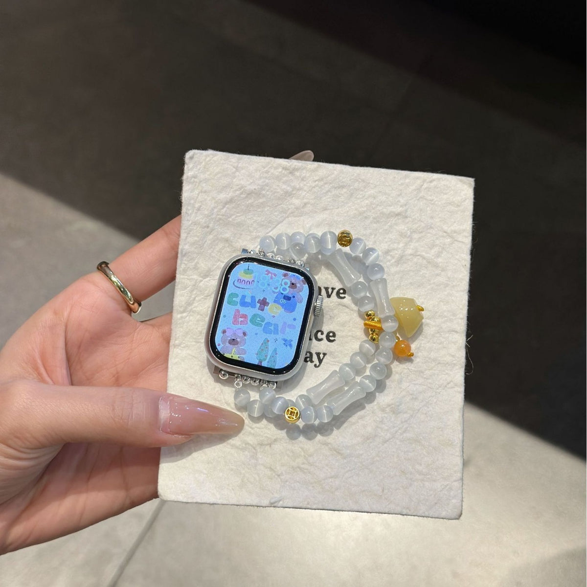 White frosted bead Apple Watch bracelet band with yellow heart charm