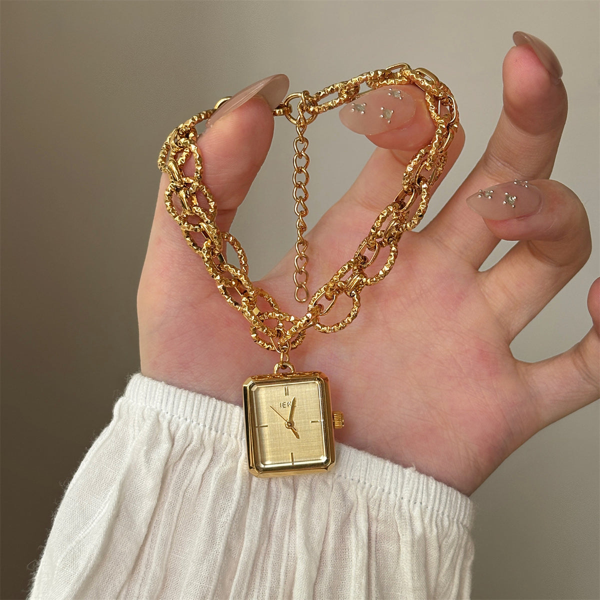 IEKE gold-tone chain bracelet watch with champagne dial