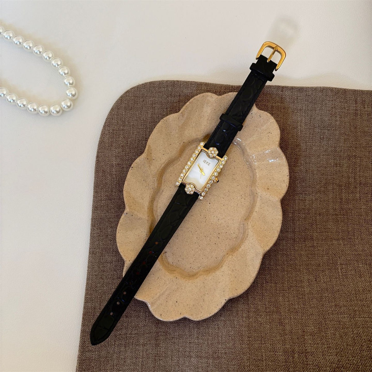 IEKE women's rectangular crystal watch with champagne dial, gold-tone case and black crocodile-embossed strap