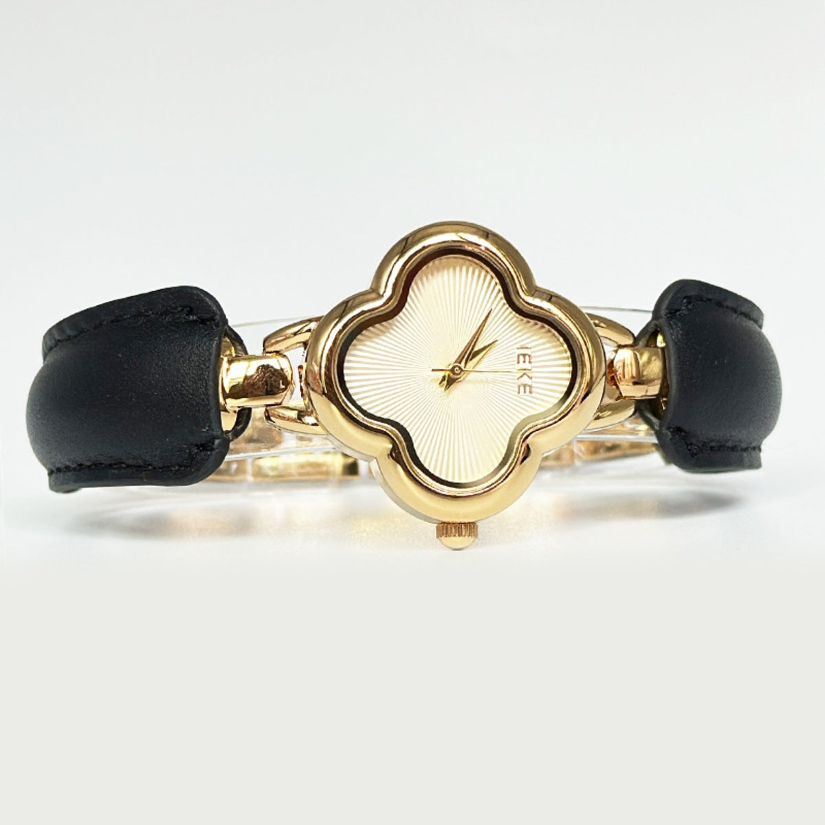 IEKE gold clover watch champagne dial black accents