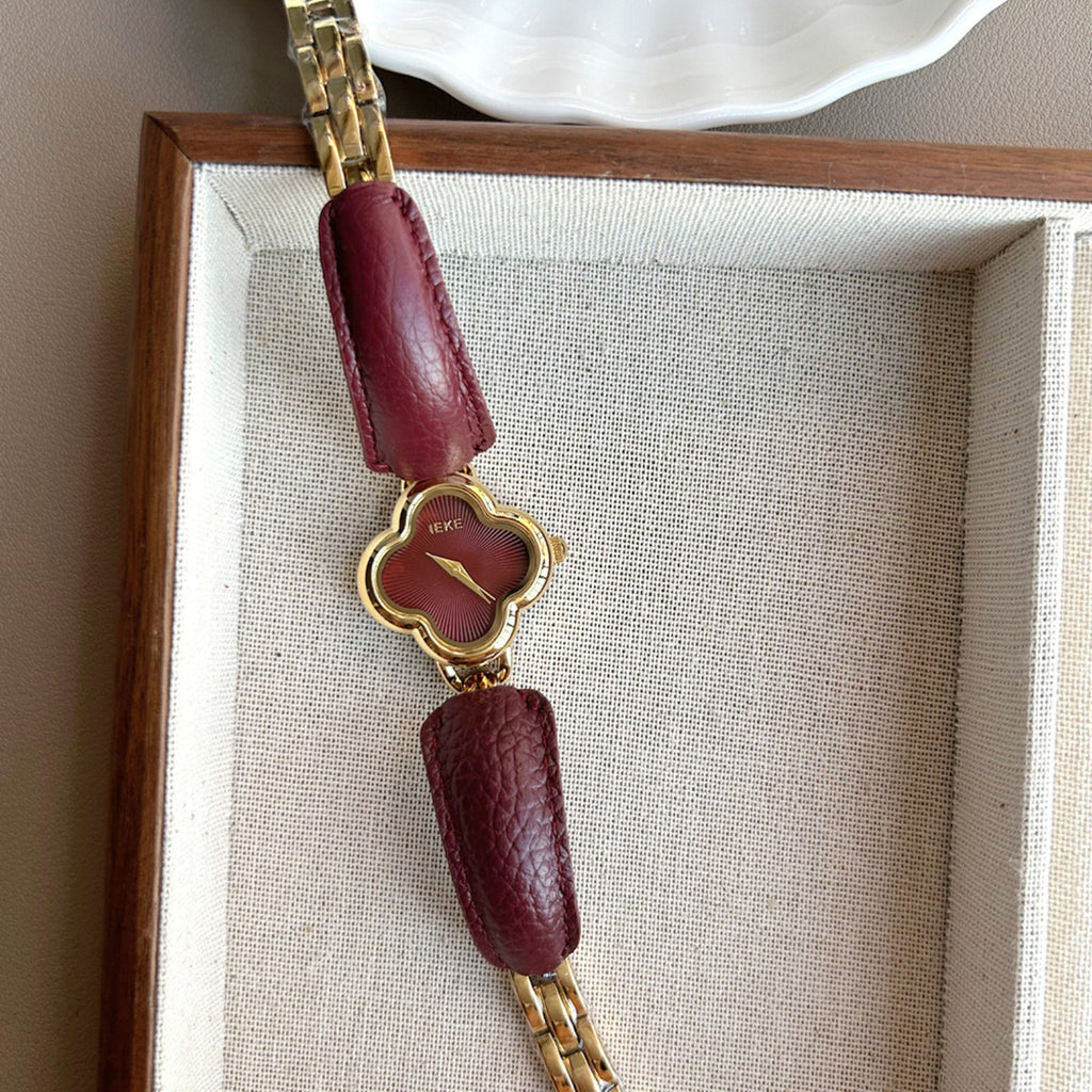 IEKE gold clover-shaped women's watch with burgundy dial and burgundy leather accents