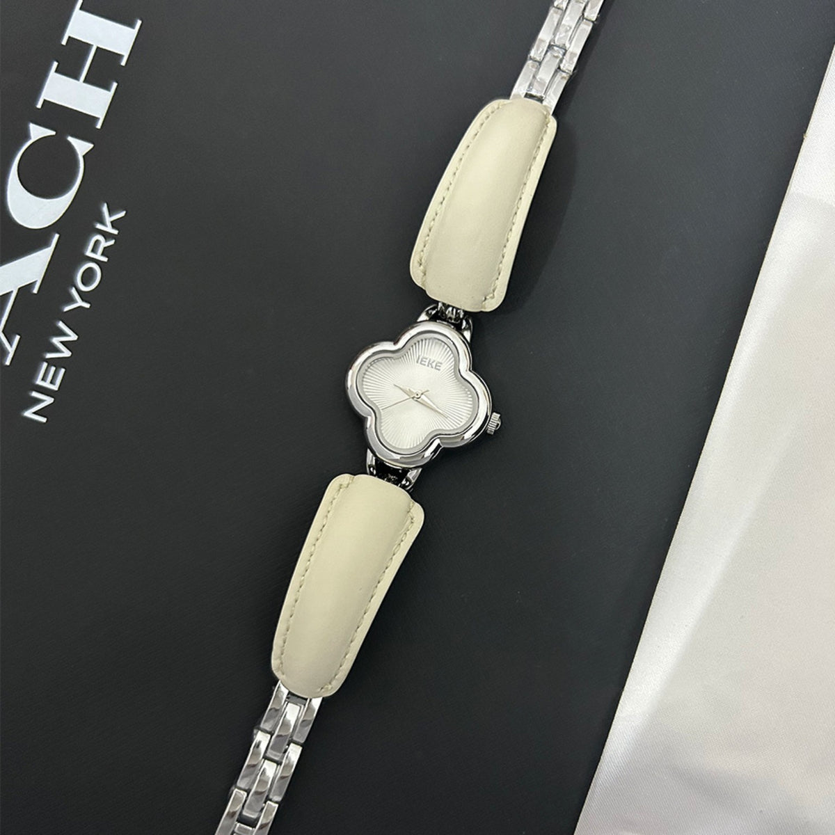 IEKE clover-shaped women's watch in silver with ivory dial and cream leather accents