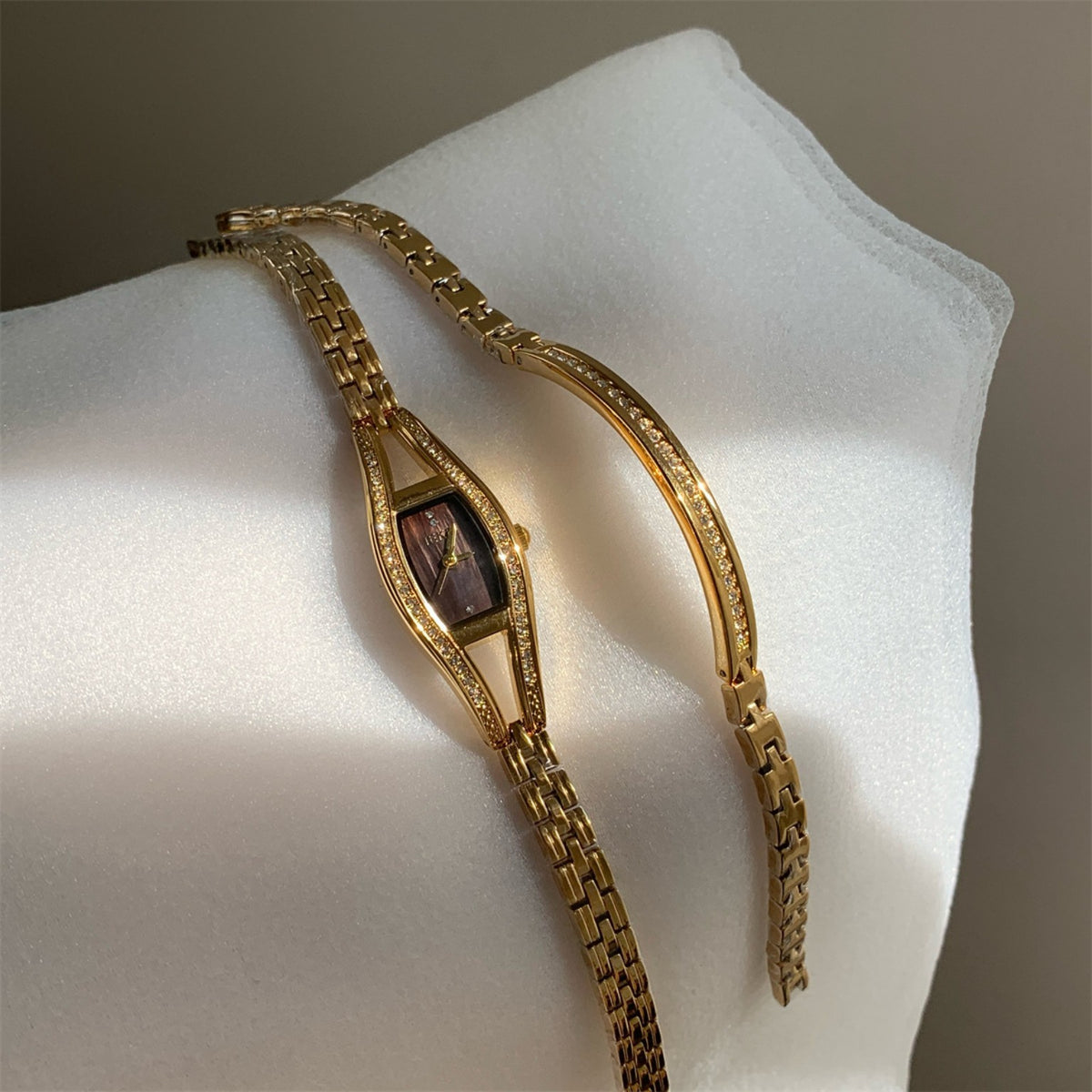 IEKE women's crystal bracelet watch in gold tone with dark dial