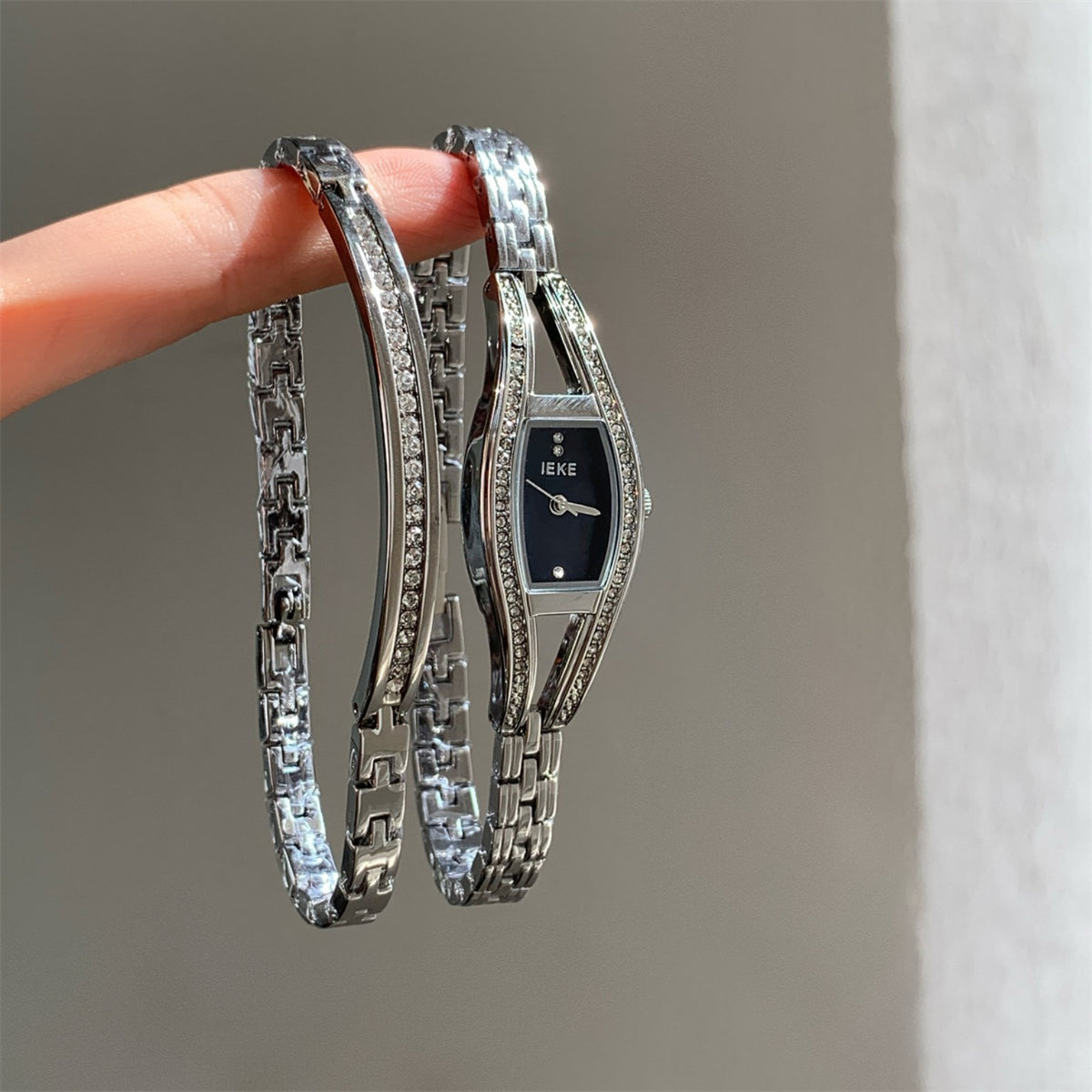 IEKE women's crystal bracelet watch in silver tone with black dial
